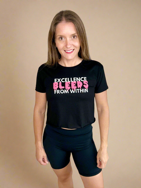 Female model wearing Bleeding Excellence Crop T.
