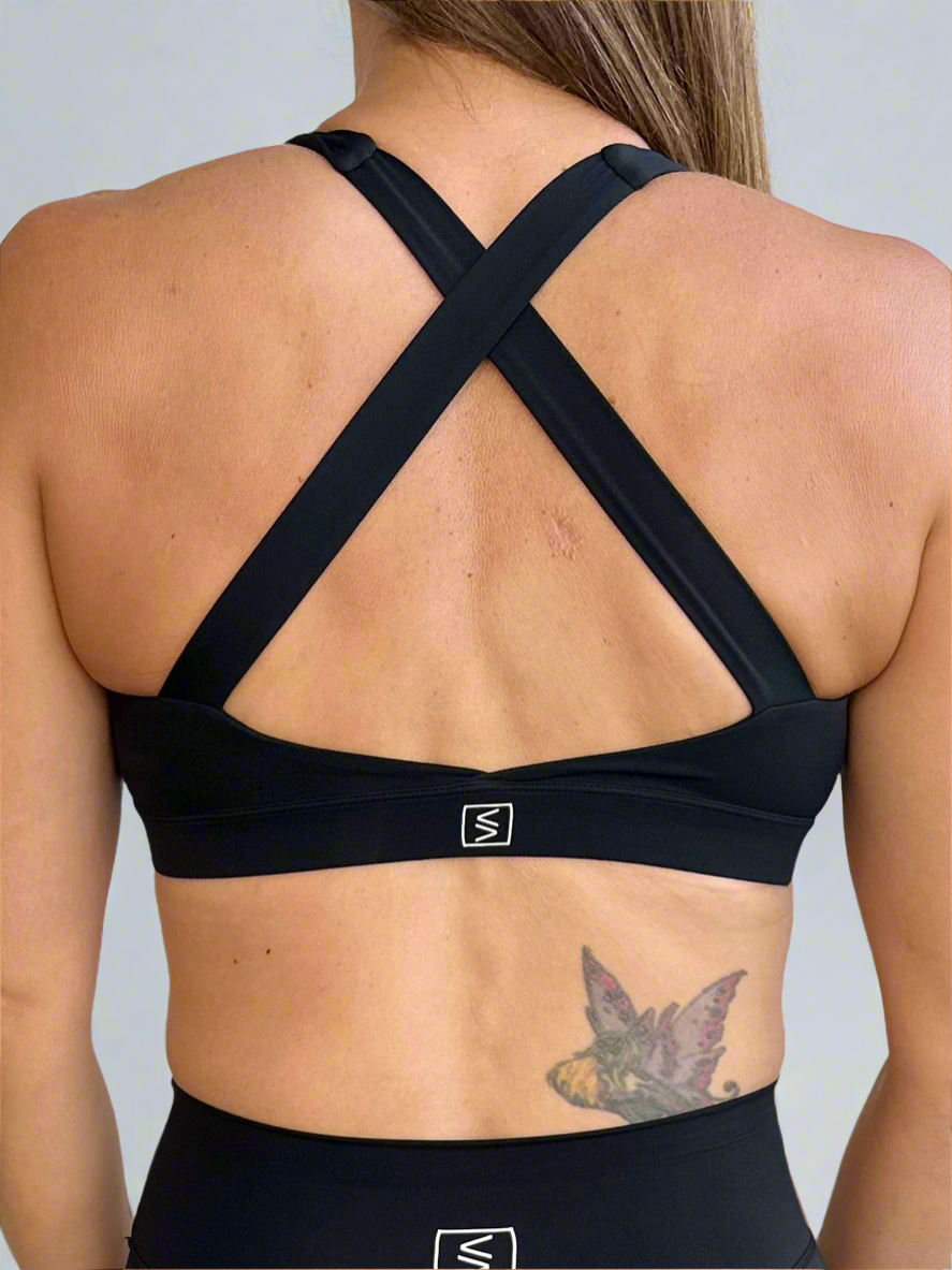 Back image of model wearing Rival Fit Gear Ignite X Bra in black.