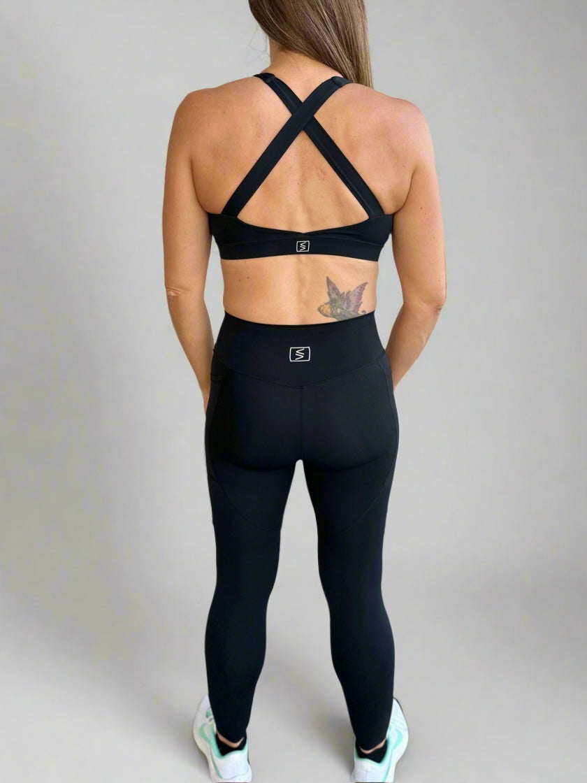 Back image of model wearing Rival Fit Gear Ignite sportwear matching X Bra and Leggings.
