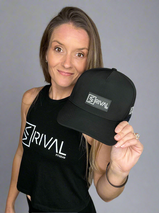 Model holding Legacy Curve Bill Hat.