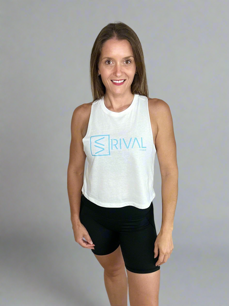 Female model wearing Legend Classic Crop Tank in Ocean White from front view.