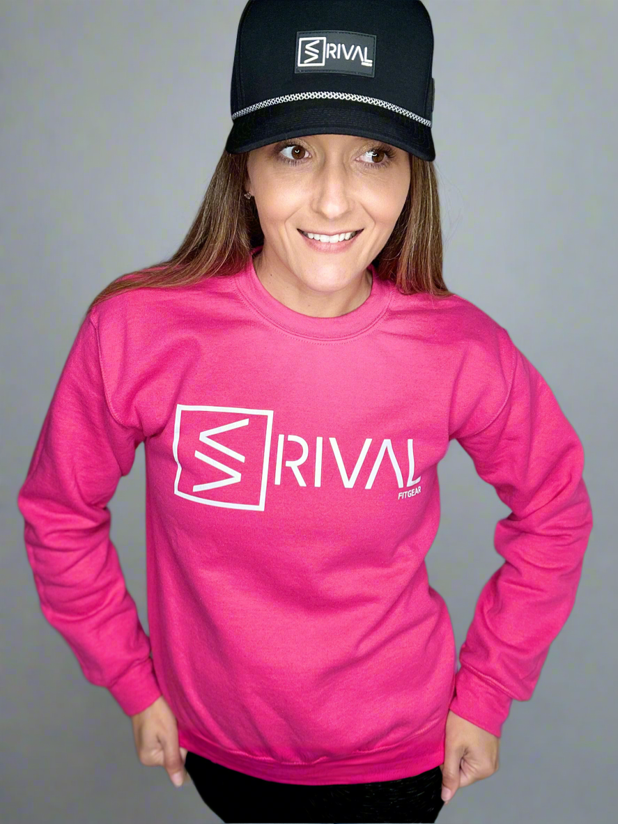 Model wearing a Legend Classic Powerhouse Pink Crew Sweatshirt in a studio.