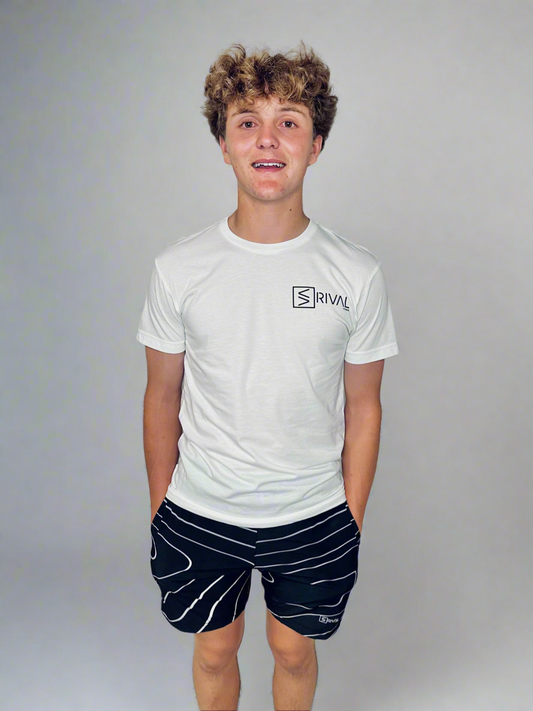 Front side of male model wearing Legend Classic T and Tidal Wave Shorts.