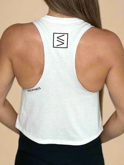 Female model showcasing Legend Classics Crop Tank in white Expect Greatness details.