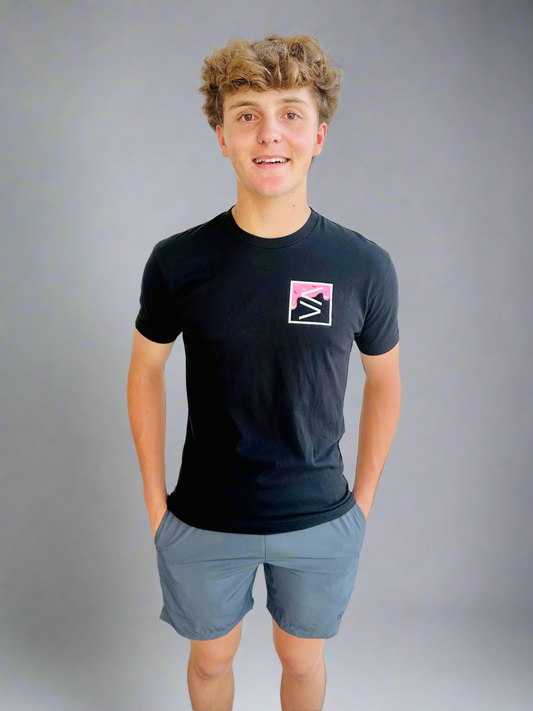 Male model wearing Graphite Performance Shorts and Baller Drip Shirt by Rival Fit Gear.