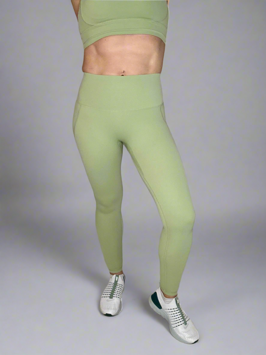 Female showcasing Powerflow Leggings in Mint.