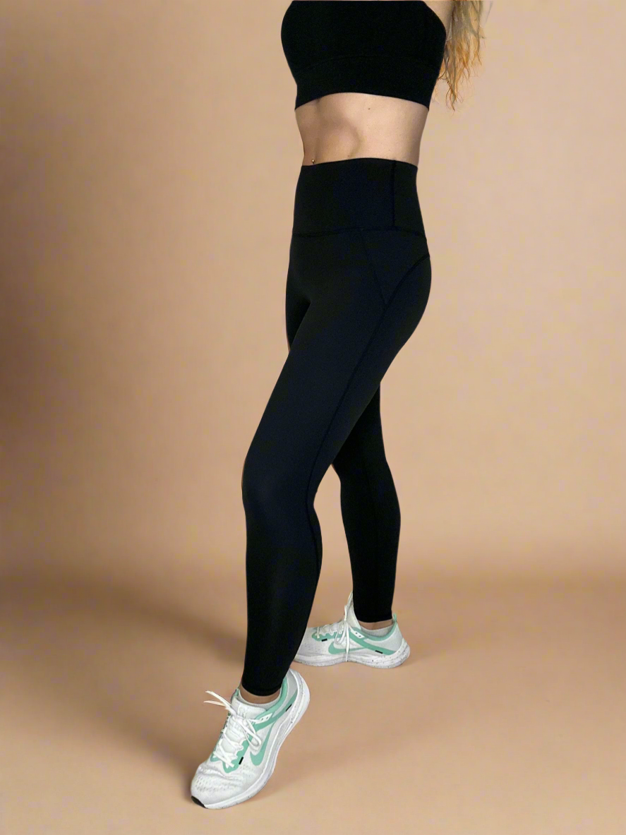 Side details of Powerflow Leggings in Black.