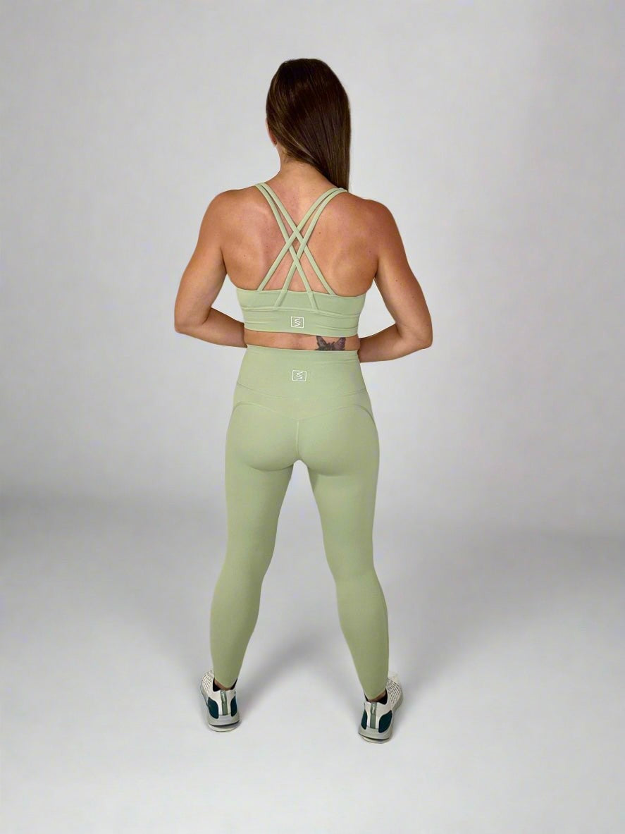 Female model showcasing Powerflow workout set by Rival Fit Gear.