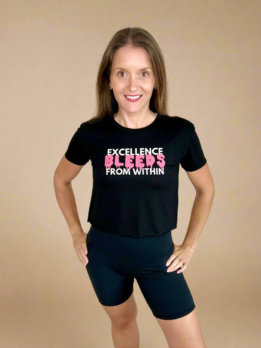 Female model wearing Bleeding Excellence Crop T by Rival Fit Gear.