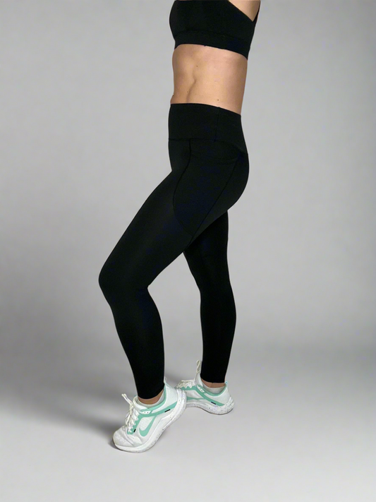Model showcasing Ignite Pocket Leggings by Rival Fit Gear 
in Black side view.