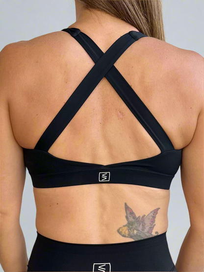 Back image of model wearing Rival Fit Gear Ignite X Bra in black.
