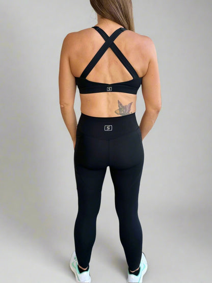 Back image of model wearing Rival Fit Gear Ignite sportwear matching X Bra and Leggings.