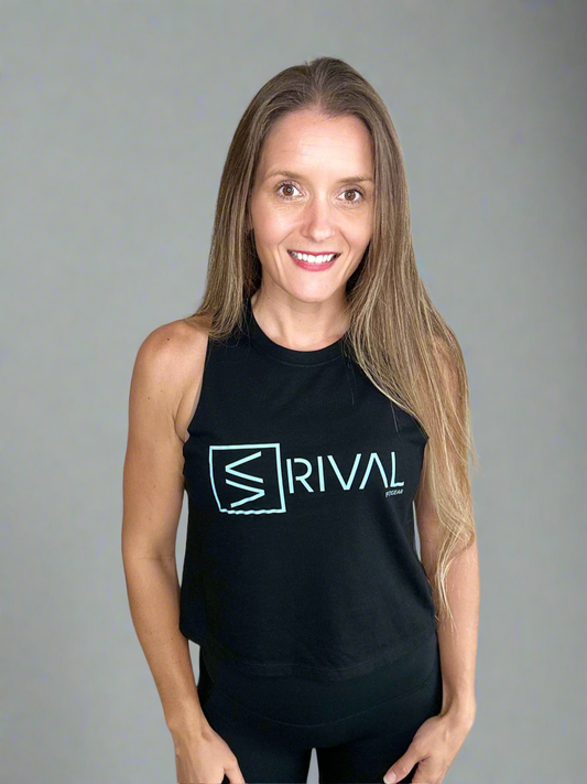 Front of female model wearing Legend Classic Crop Tank in Ocean Black. 