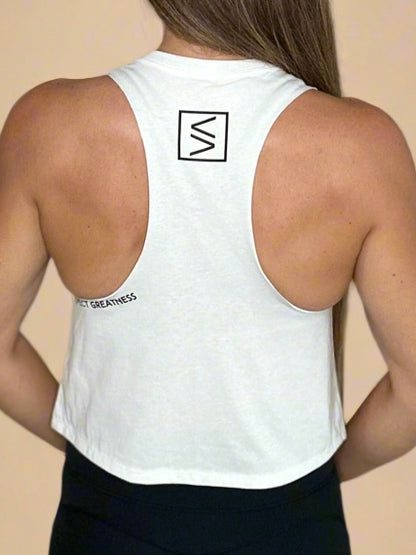 Female model showcasing Legend Classics Crop Tank in white Expect Greatness details. 