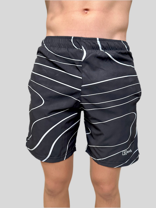 Male model wearing Tidal Wave Shorts by Rival Fit Gear.
