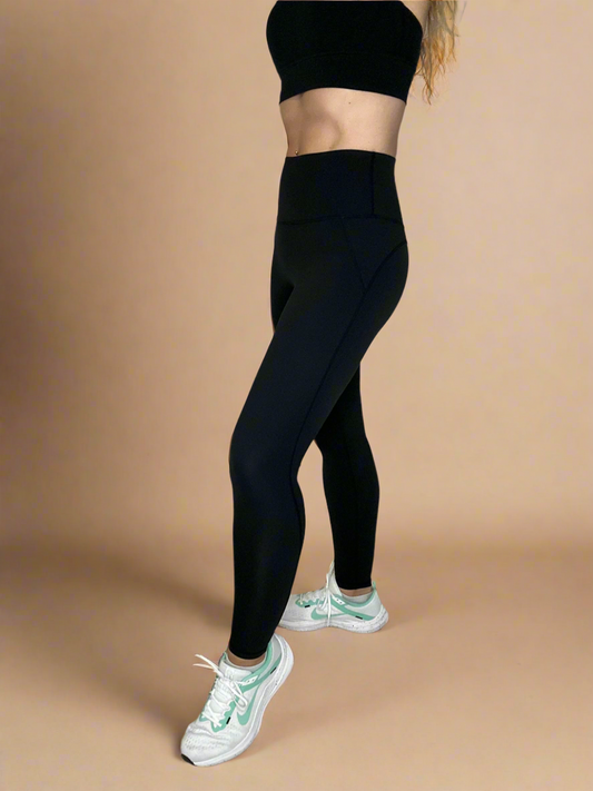 Side details of Powerflow Leggings in Black.