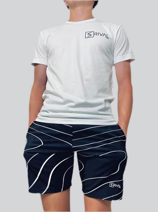 Men's model showcasing Tidal Wave Shorts and Traditional Legend Classic T by Rival Fit Gear. 