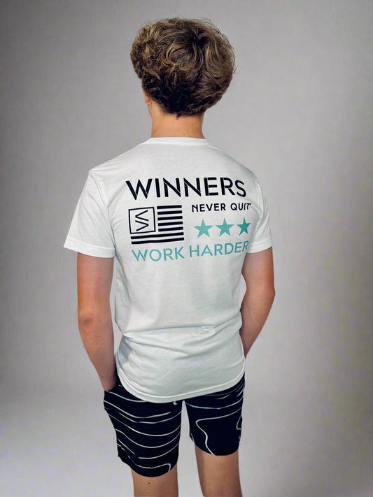 Male wearing Winners Work Harder T and Tidal Wave Shorts.